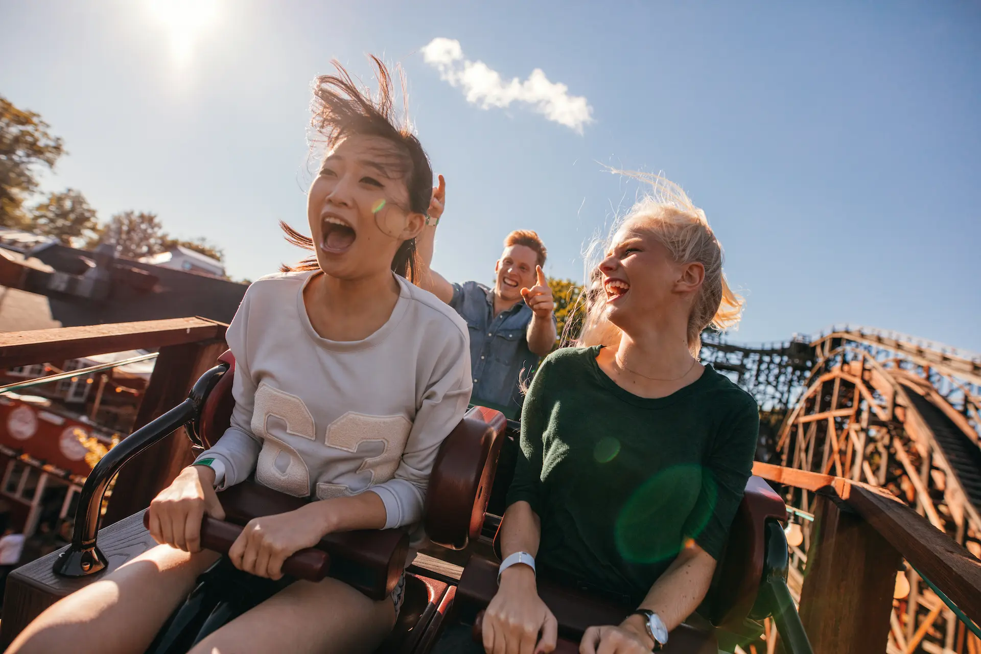 Friends enjoying an amusement park ride
