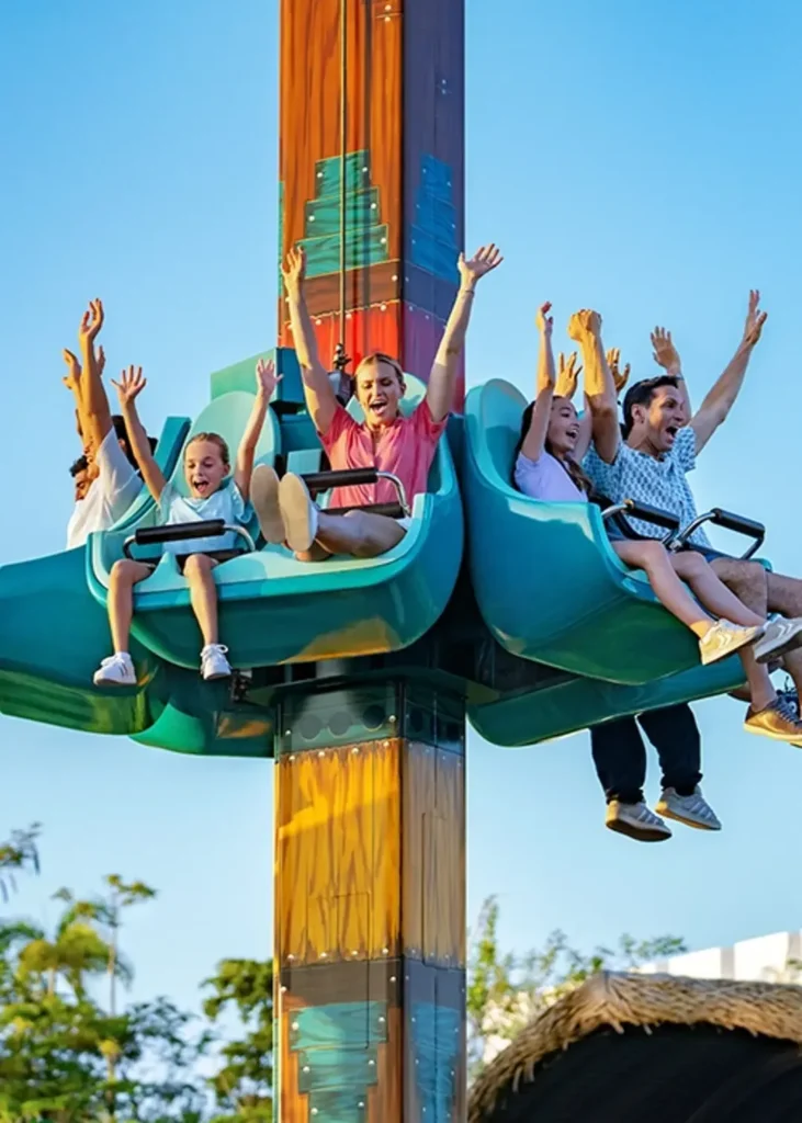 Guests on an amusement ride at BON in VidantaWorld Vallarta–Nuevo Nayarit