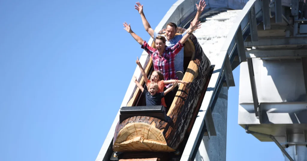 Guests descending a log flume at Calaway Park near Calgary