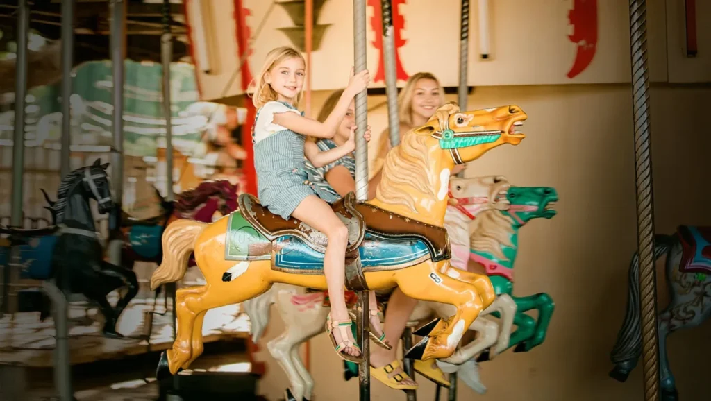 Children riding the carousel at Camden Park