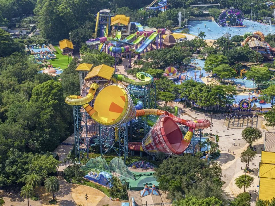 An aerial view of colourful waterslides, pools and greenery at Chimelong Water Park in Guangzhou