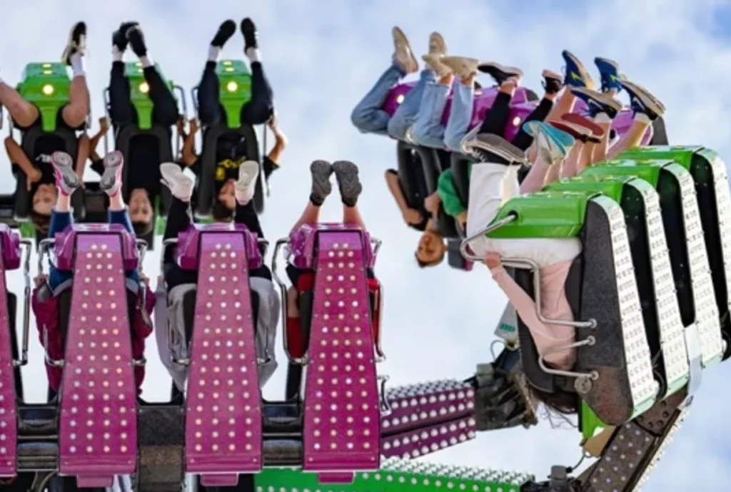 Visitors riding an outdoor thrill attraction at Curry’s Fun Park Portrush
