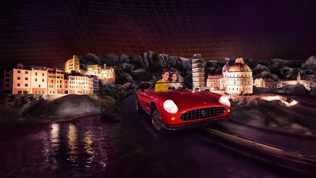 Guests on a car-themed ride at Ferrari World Abu Dhabi