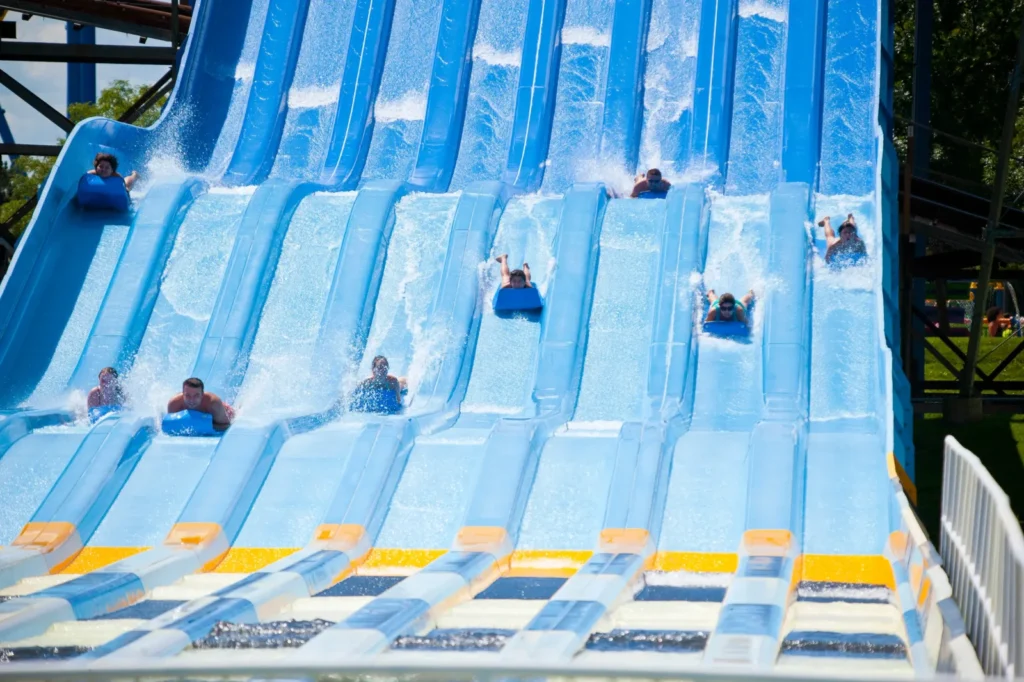 Guests race down parallel blue water slides at Splash Works in Vaughan