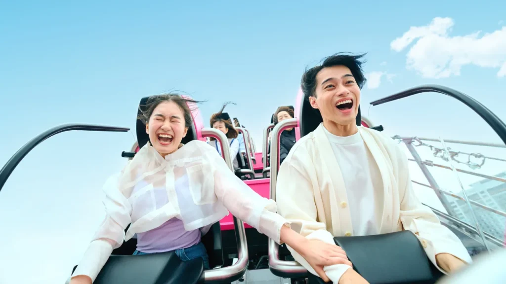Riders enjoying a roller coaster at Tokyo Dome City Attractions