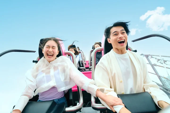 Riders enjoying a roller coaster at Tokyo Dome City Attractions