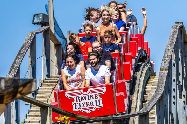 Passengers cresting a hill on Ravine Flyer II at Waldameer in Erie