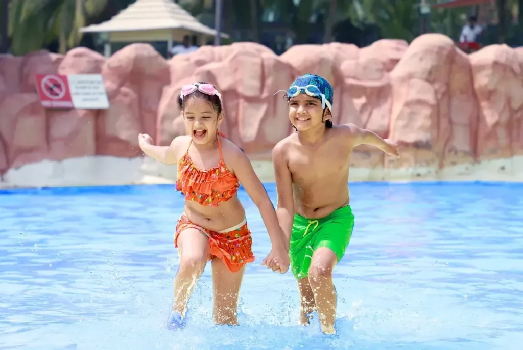 Children enjoying a swimming pool at Water Kingdom near Gorai in Mumbai