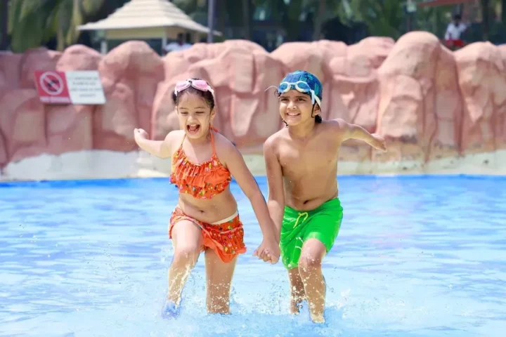 Children enjoying a swimming pool at Water Kingdom near Gorai in Mumbai