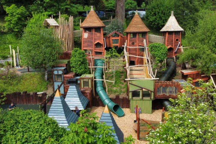 Wooden play towers and slides at Hobbledown Bay in Watermouth Castle