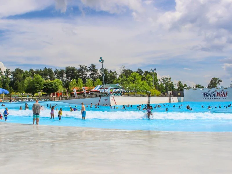 Visitors enjoying Thunder Bay Wave Pool at Wet ’n Wild Emerald Pointe