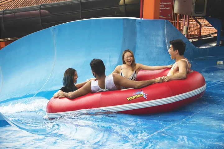 A group riding a red Ular-Lah raft at Wild Wild Wet in Singapore
