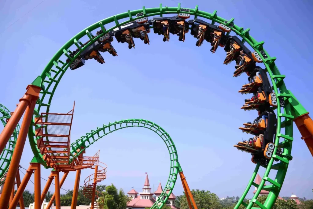 Recoil coaster train passing through a green loop at Wonderla Bengaluru
